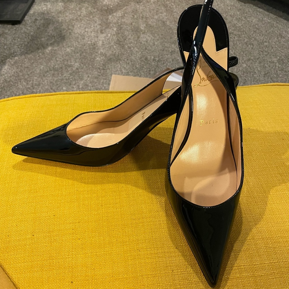 Christian Louboutin slingback heels in patent leather.